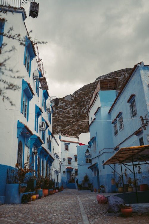 Garment factory workers sewing clothing on production line in modern manufacturing facility