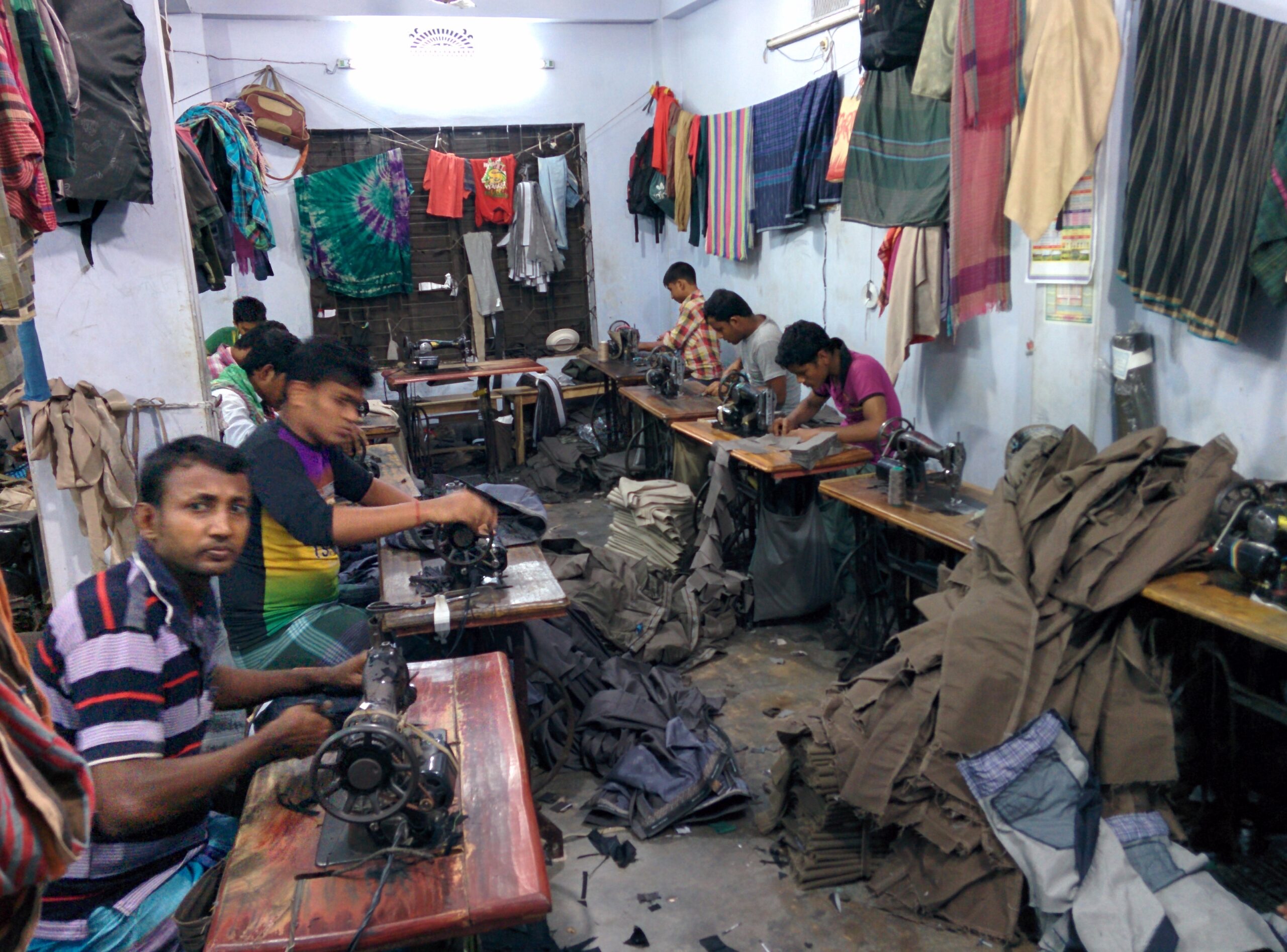 Garment factory production floor with workers sewing clothing in Bangladesh MOQ negotiation