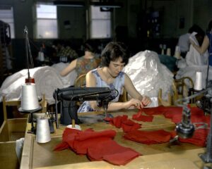 Inside a garment factory showing workers producing clothing on production floor