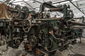 Textile machinery in a clothing manufacturing facility showing production equipment