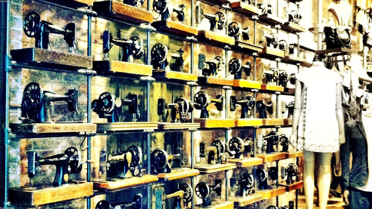 Industrial sewing machines in a garment factory producing streetwear clothing with heavy duty thread