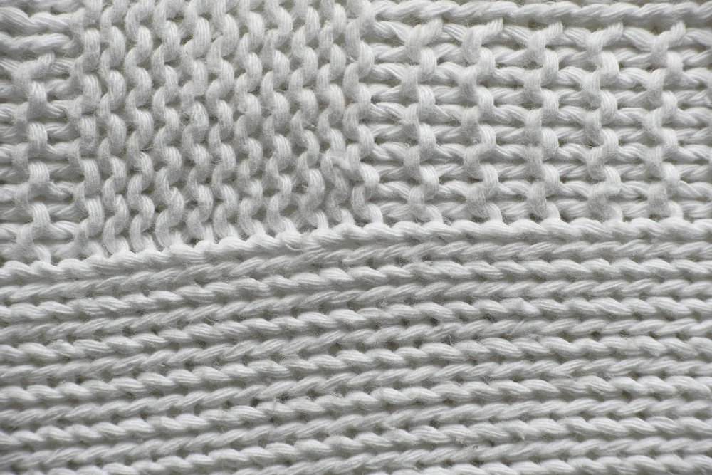 Close-up of ribbed cotton knit fabric texture used by a crop top manufacturer