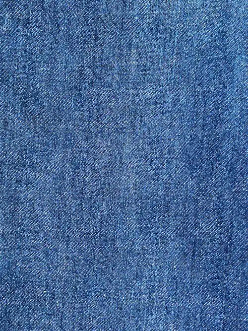 Close-up of woven fabric texture before garment washing techniques are applied