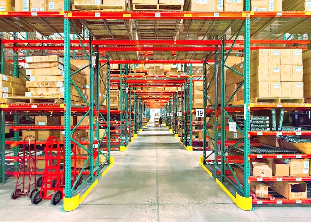 Warehouse racking holding a packed multi-SKU minimum order quantity clothing shipment