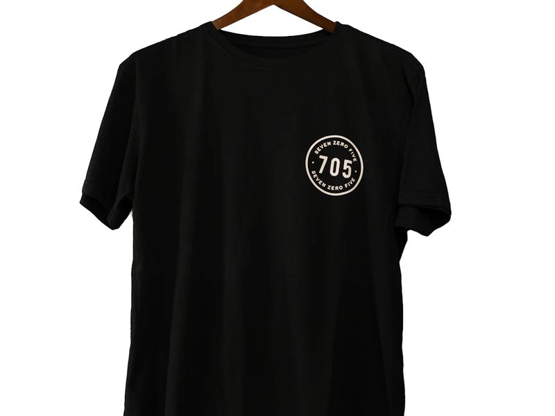 Black t-shirt with custom private label chest print produced for a clothing brand
