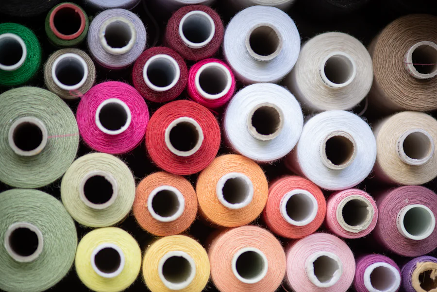 Colorful thread spools used for stitching and trim work at a sports bra manufacturer