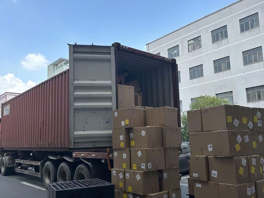 Cartons being loaded into a shipping container outside PRP Apparel's Dongguan factory