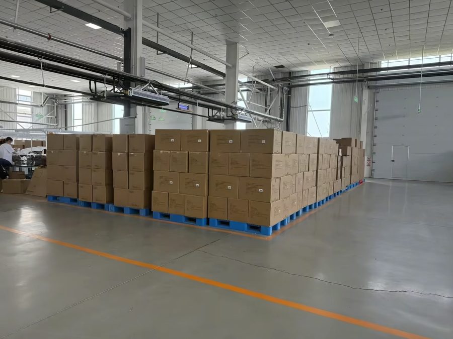 Palletized cartons staged in the warehouse ahead of shipment, illustrating total manufacturing lead time
