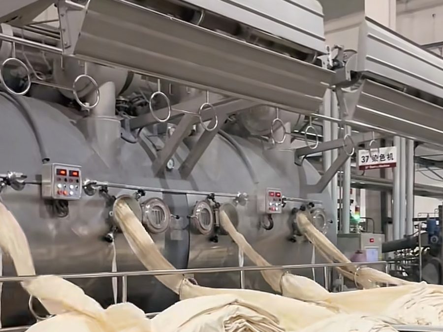 Raw cotton fiber pulled from a dyeing machine during cotton fabric processing