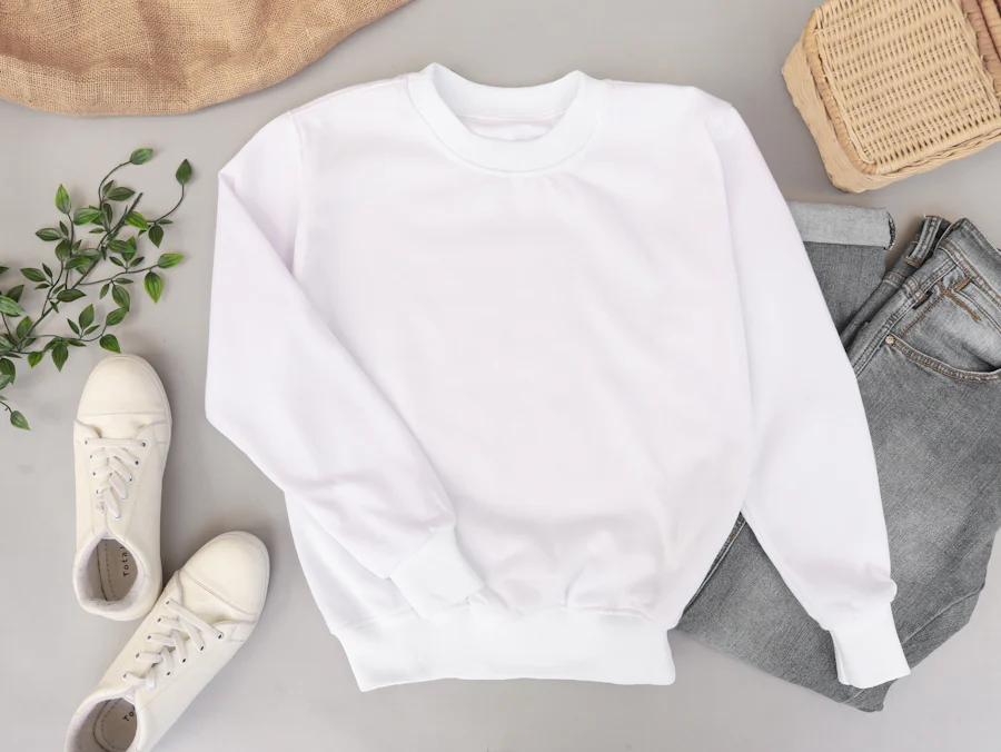 Flat-lay of a custom crewneck sweatshirt sample showing ribbed collar and cuff construction