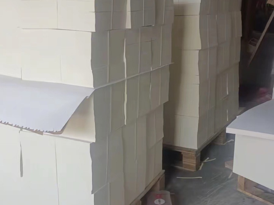 Stacked fabric roll inventory in PRP Apparel's Dongguan warehouse ready for cutting