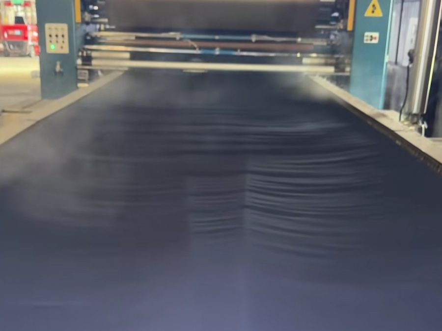 Fabric finishing and inspection line for healthcare uniform manufacturing