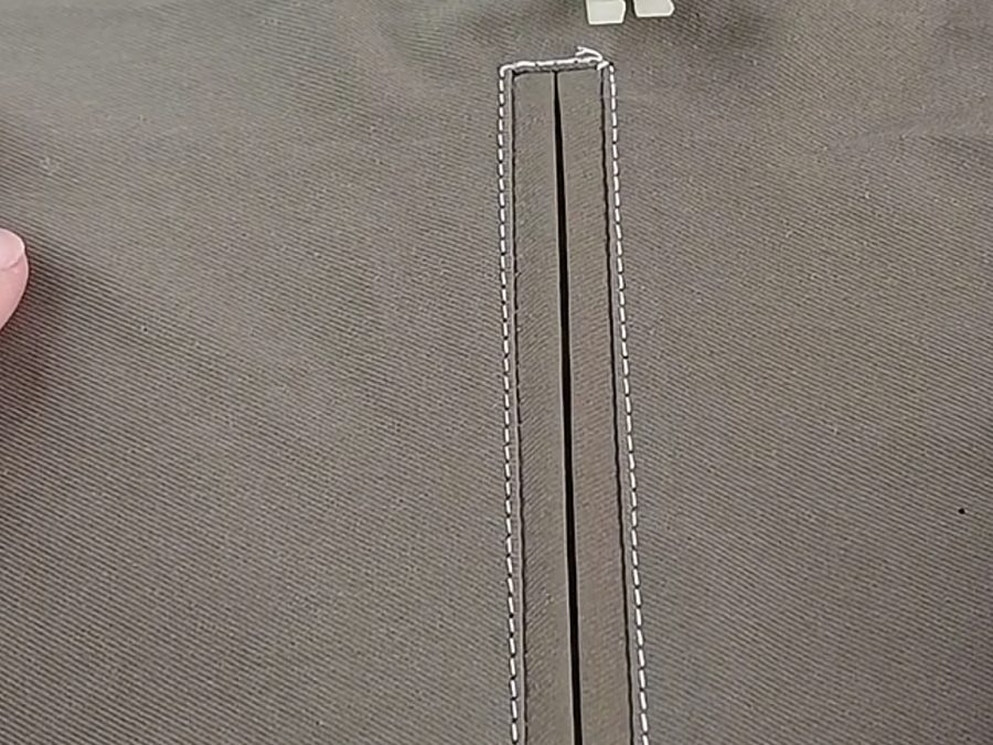 Welt pocket construction stitching detail on a healthcare uniform garment