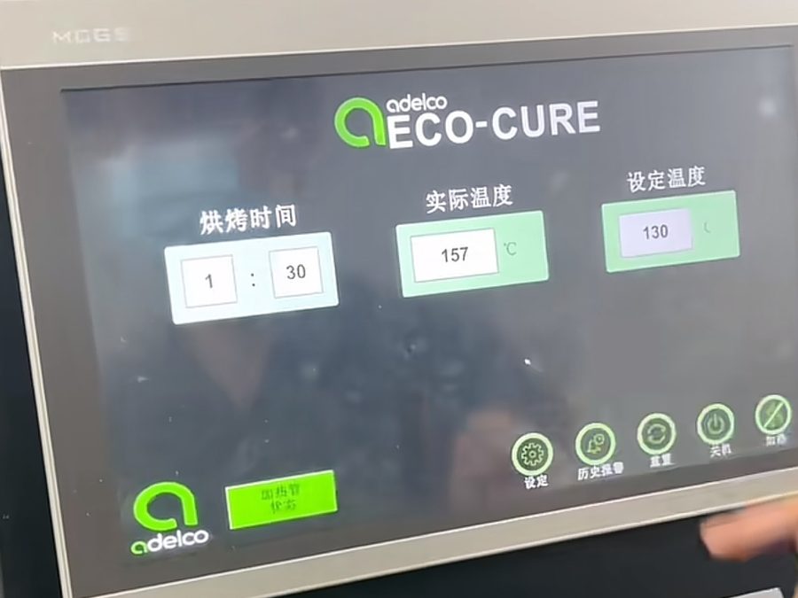 Heat-transfer cure press control panel showing temperature and time settings for durable logo branding