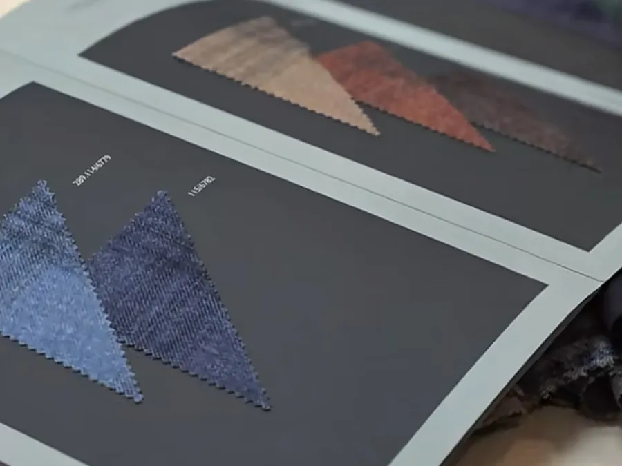 Fabric swatch cards with reference codes used as color standards in the lab dip approval process