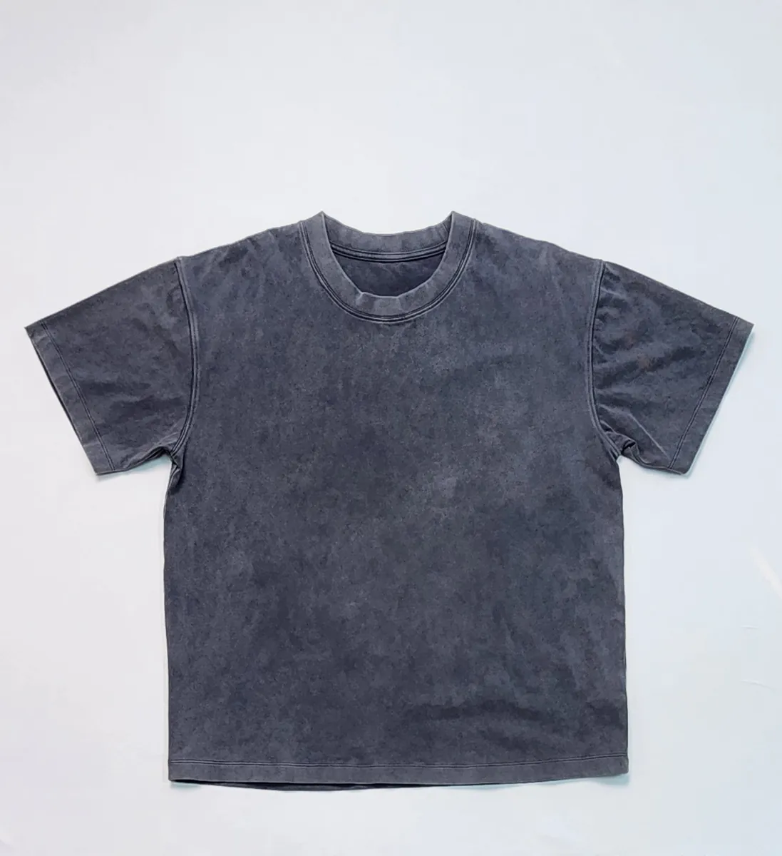 Blank cotton tee body before ringer tee contrast rib-knit trim is attached
