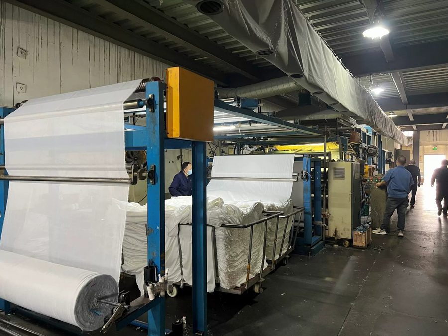 Recycled polyester rPET fabric being finished on the production line
